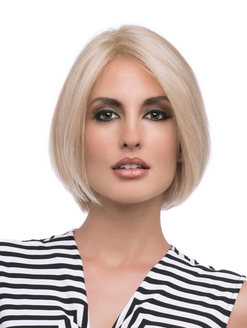 headshot of model wearing blonde chin length wig
