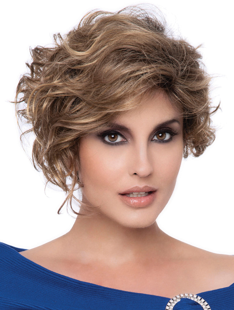 headshot of model wearing brown curly wig