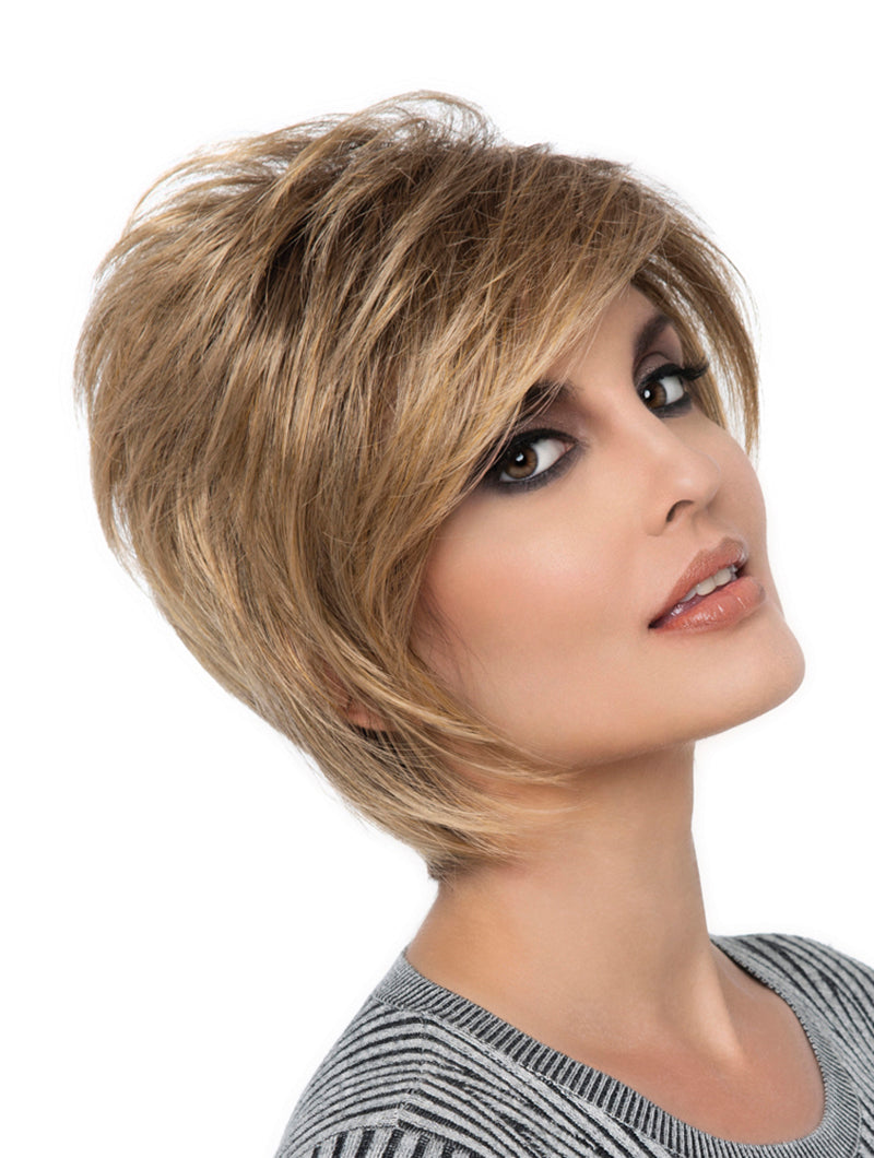 headshot of model wearing golden chin length wig
