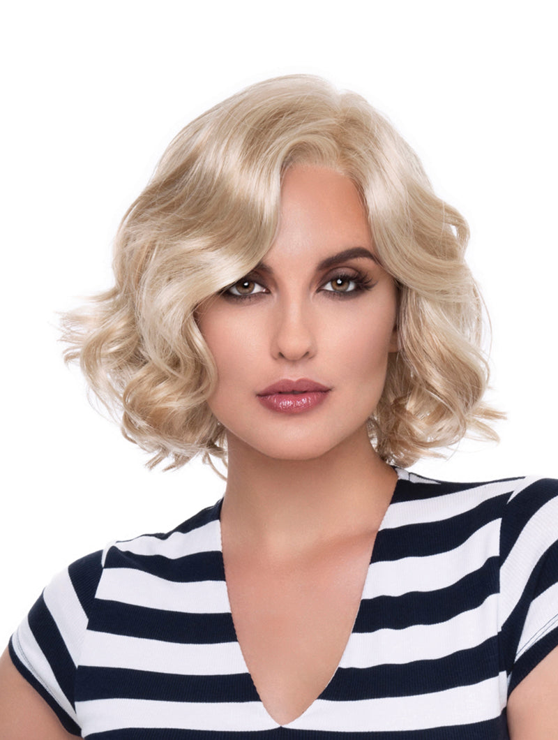 headshot of model wearing blonde chin length wig