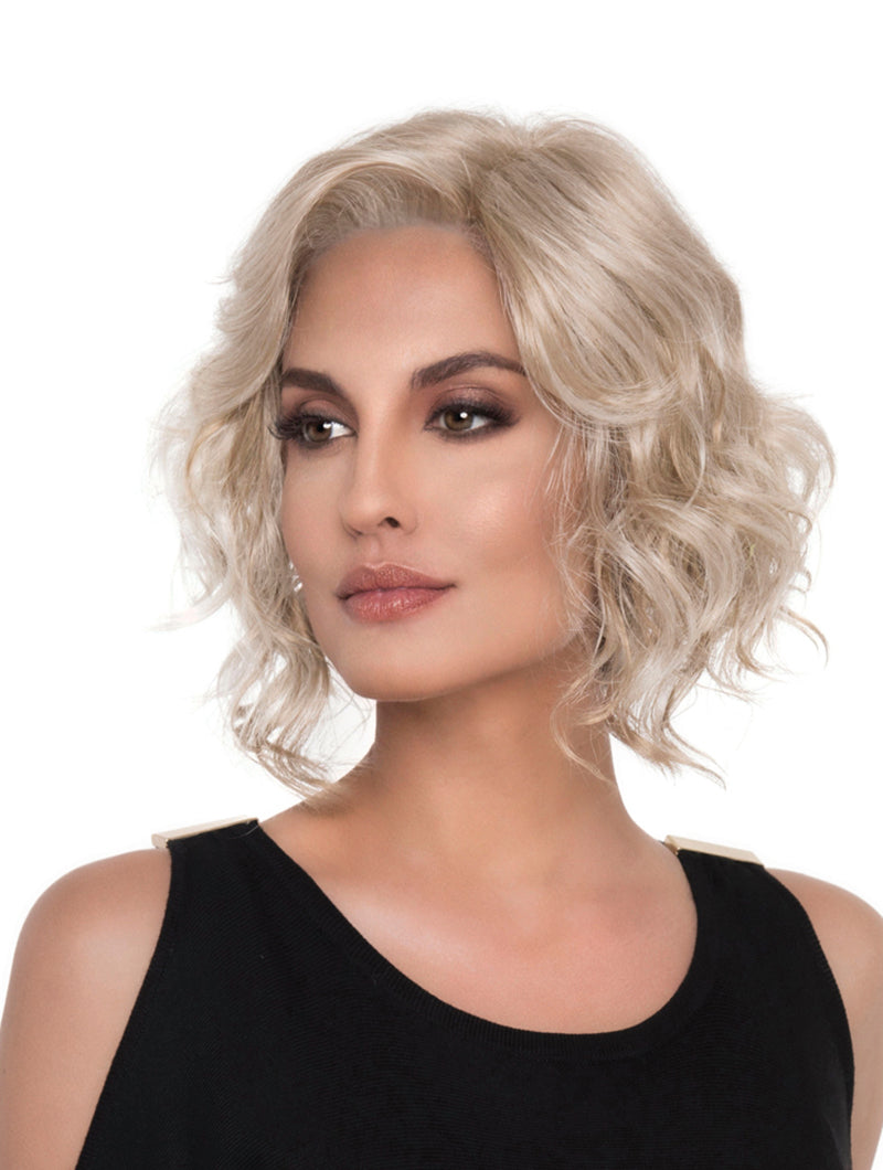 headshot of model wearing blonde chin length wig