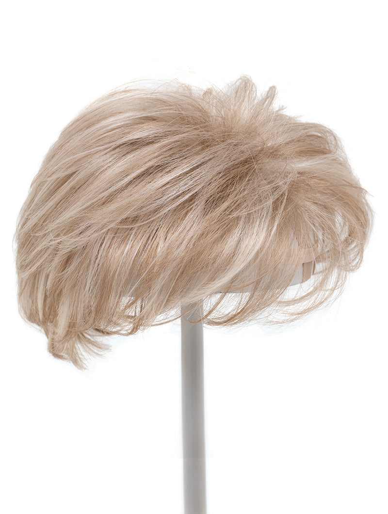 blonde layered topper on wig stand