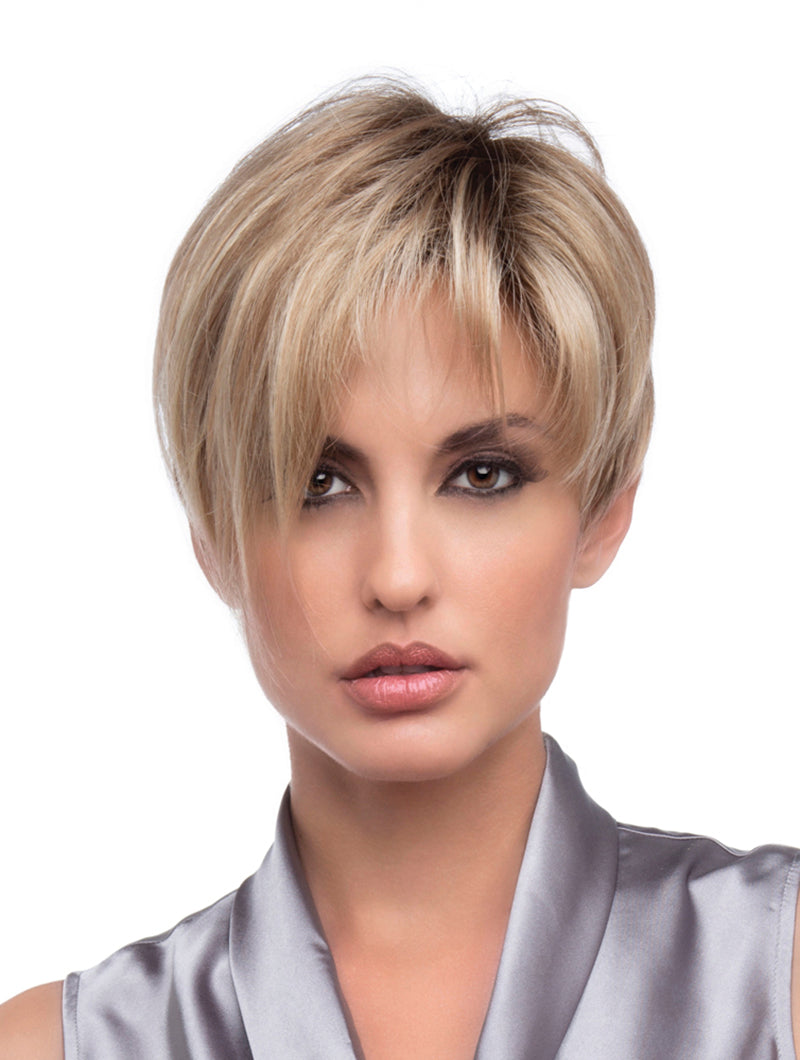 shoulders up view of model wearing blonde pixie style wig