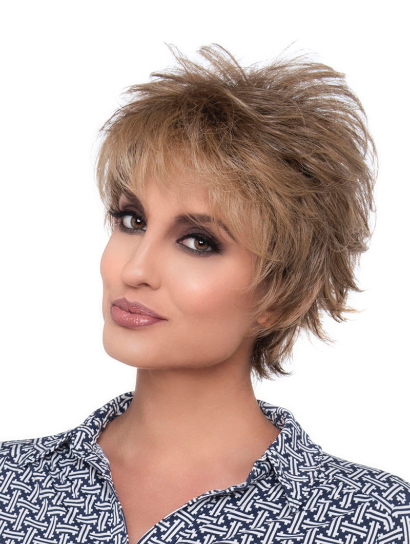 headshot of model wearing light brown spiky style wig