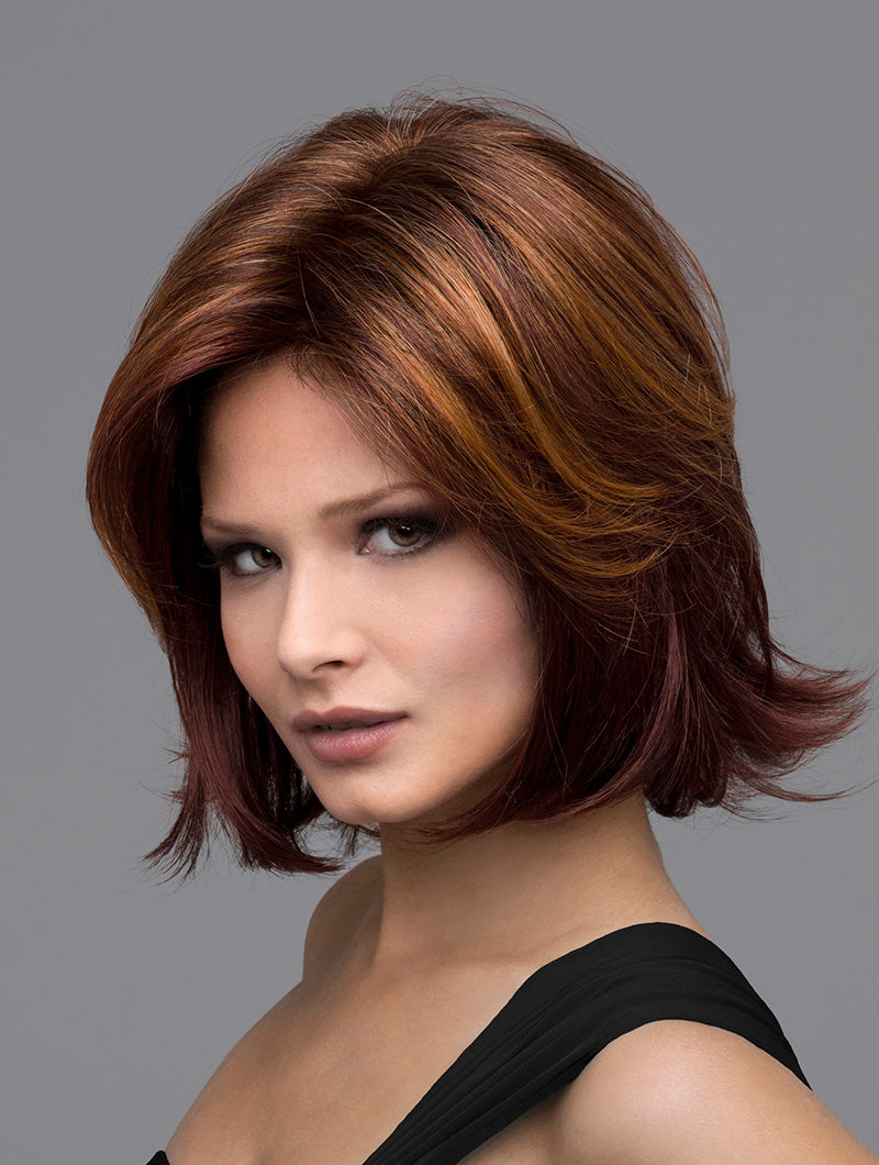 Model wearing brown and red chin length bob style wig