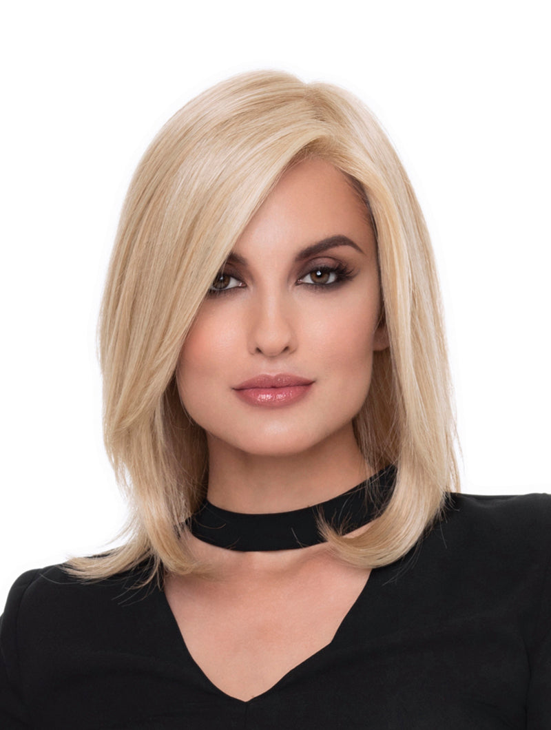 Headshot of model wearing blonde shoulder length wig