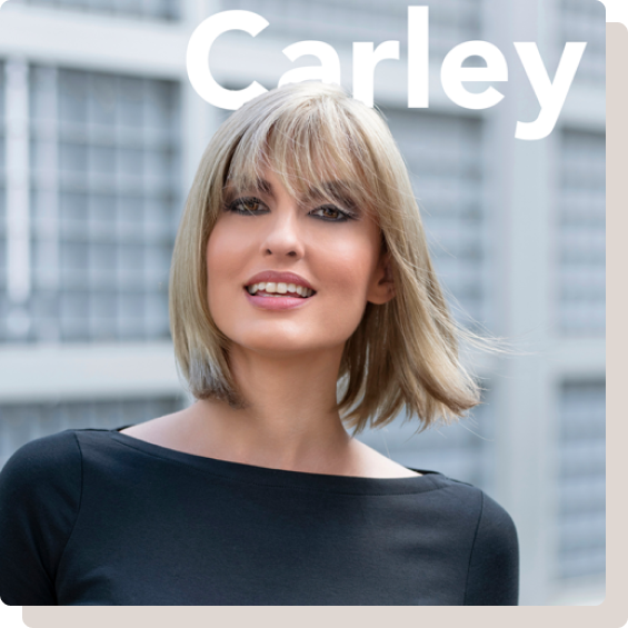 model wearing blond neck length wig with caption Carley