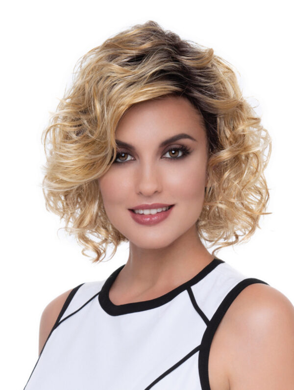 headshot of model wearing curly chin length wig