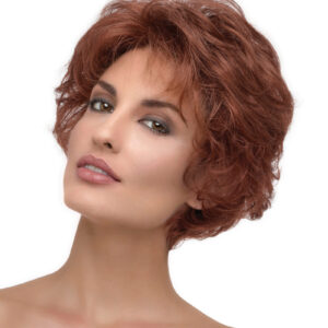 headshot of model wearing short curly red wig