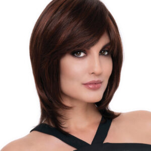 headshot of model wearing dark reddish brown chin length wig with layers