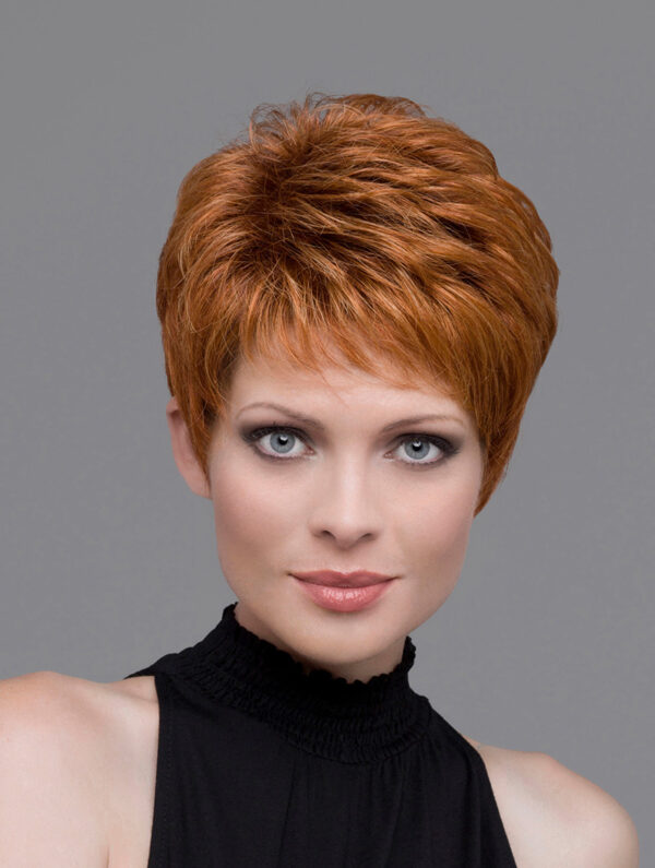 headshot of model wearing red pixie cut wig
