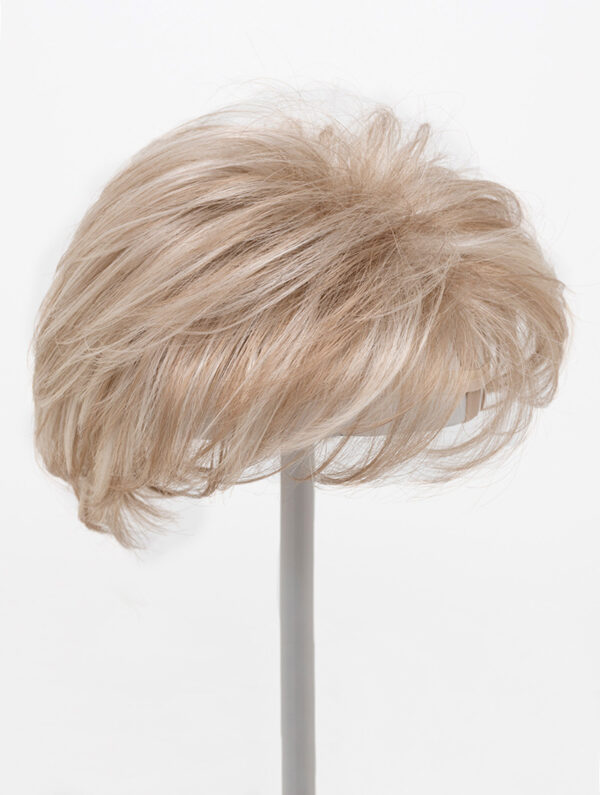 blonde layered topper on wig stand