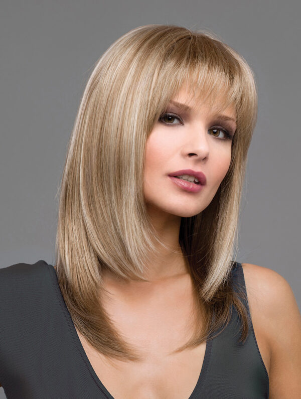 headshot of model wearing shoulder length blonde wig with bangs