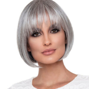 Headshot of model wearing grey bob style wig with bangs