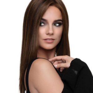 model in long brown wig looking over shoulder