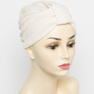 beige turban on wig head mannequin