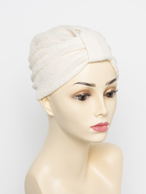 beige turban on wig head mannequin