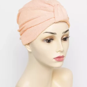peach turban on wig head mannequin