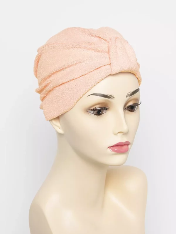 peach turban on wig head mannequin