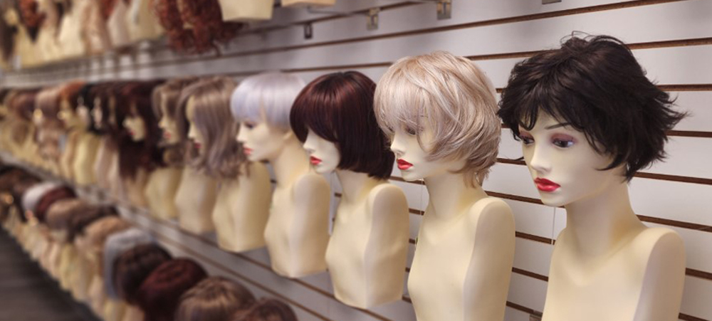 Wigs displayed on mannequin heads